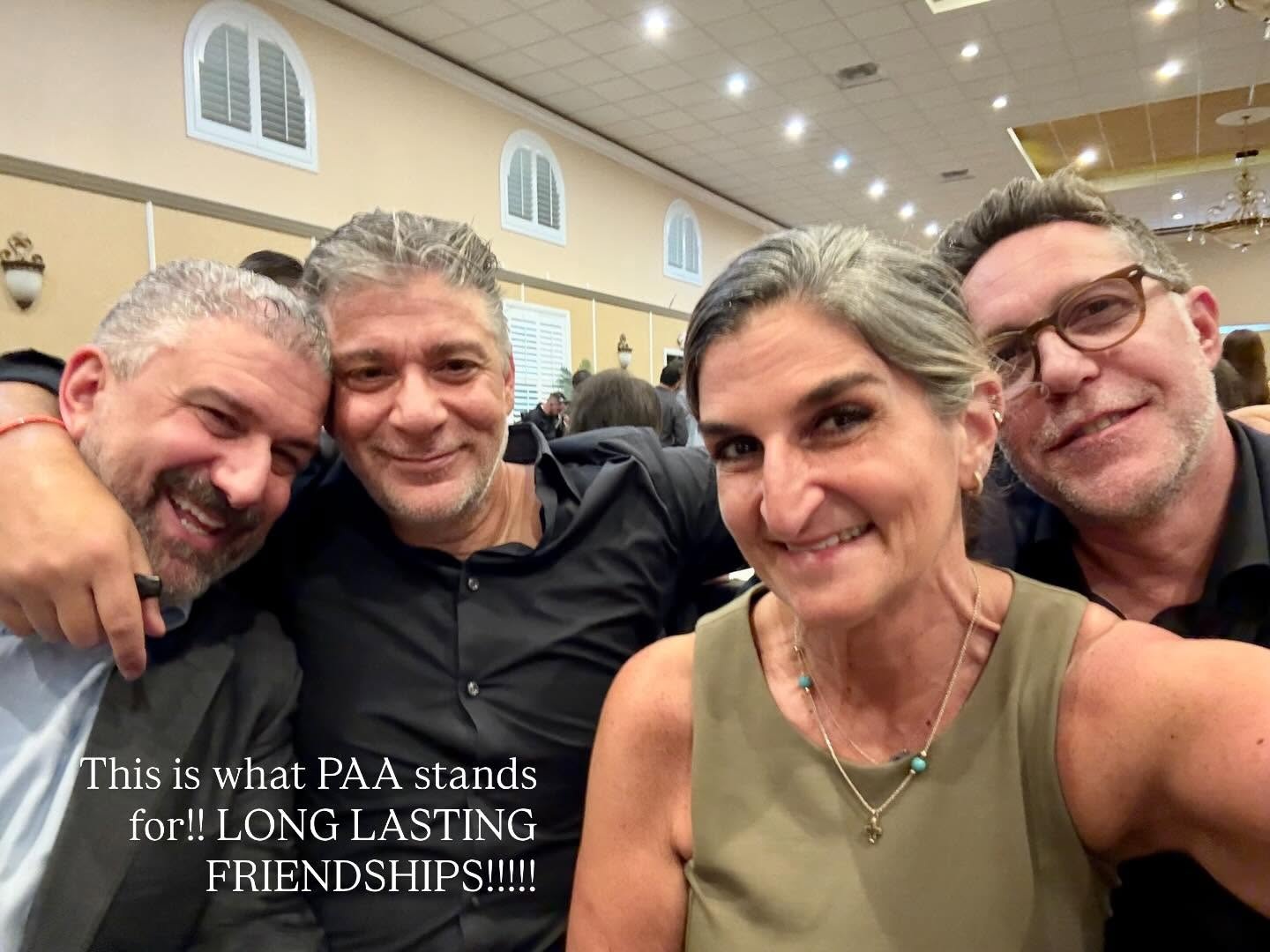 Four members smiling together at a chapter event